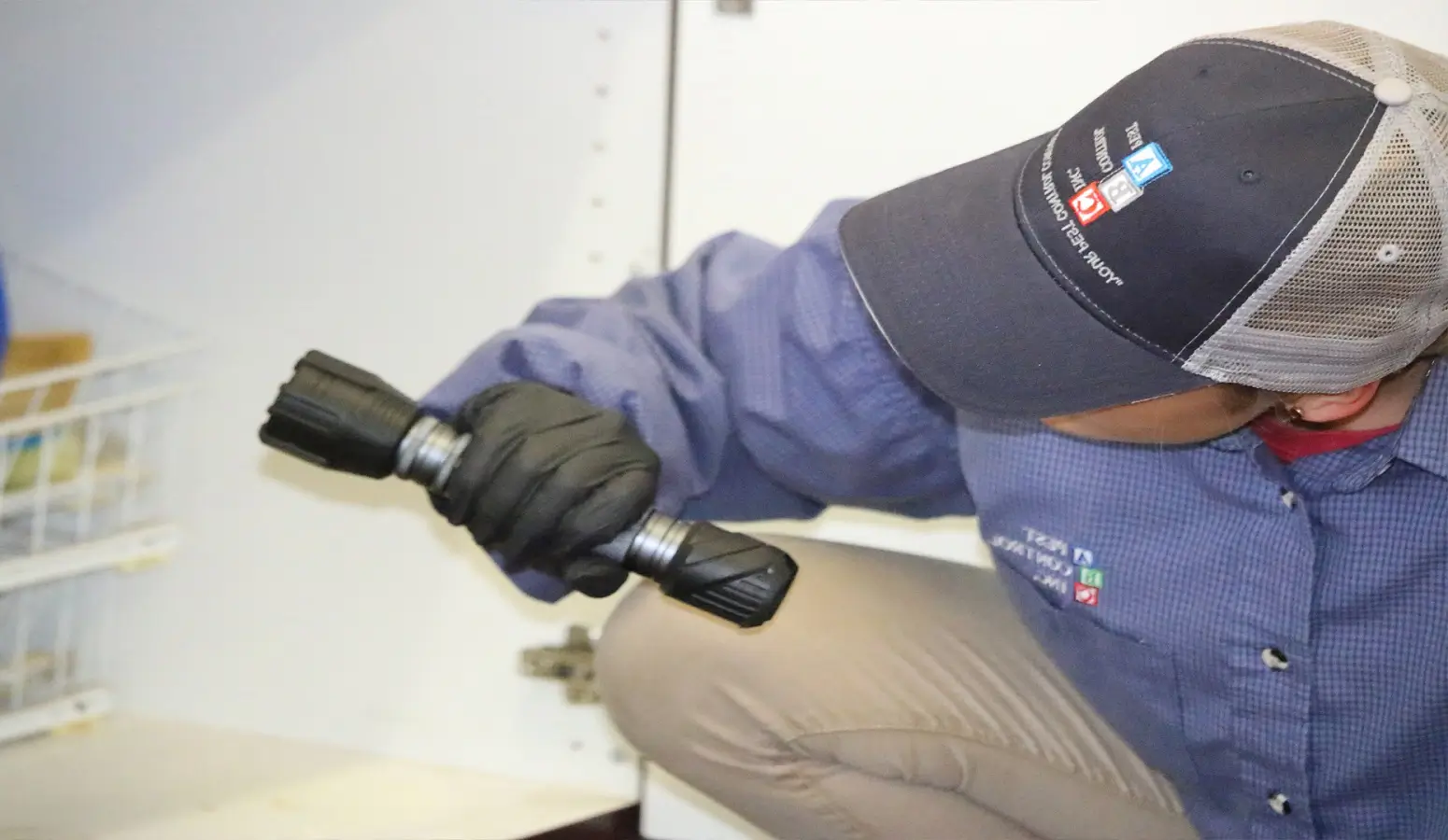 Pest control technician servicing a Florida home